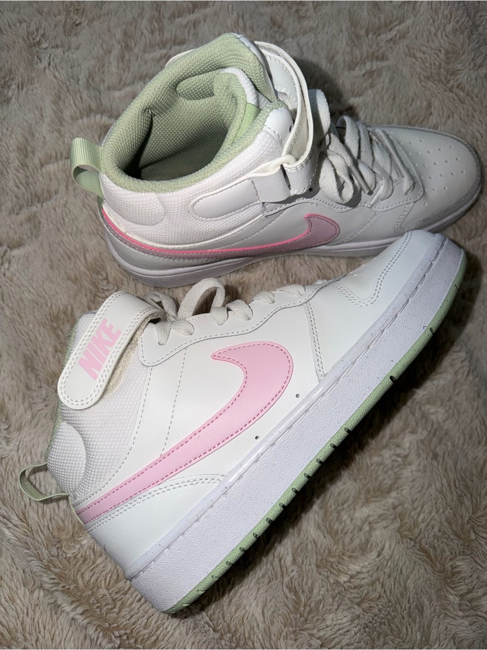 Nike Kids White Sneakers with Pink Swoosh and Light Green Accents